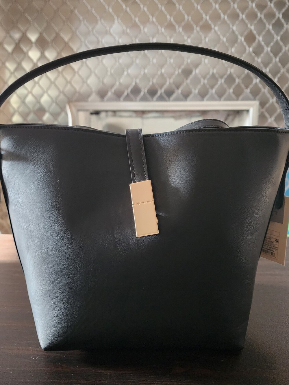 Classic Black Top-Handle Bucket Bag with Gold Accents